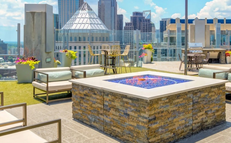 Firepit and lounge chairs at The Ascher luxury high rise apartments in Charlotte, NC