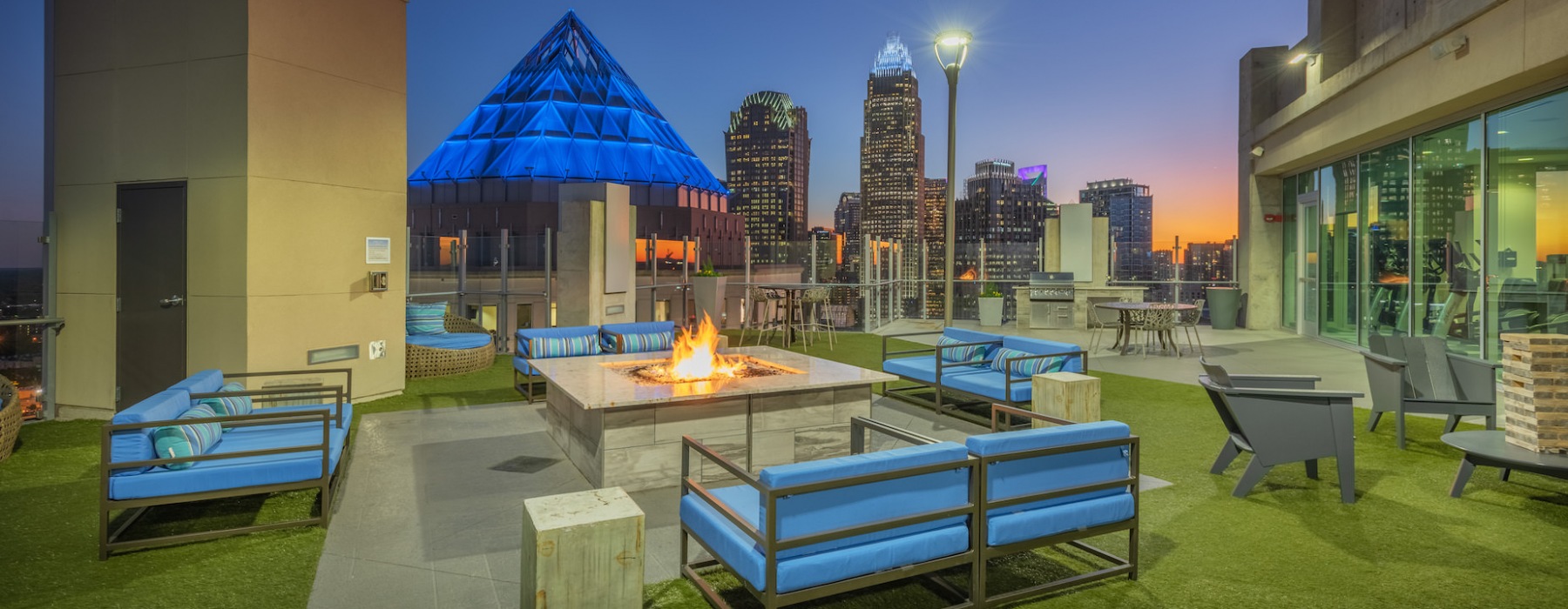 Outdoor seating with a firepit at The Ascher Uptown pet-friendly apartments in Charlotte