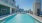 pool with lounge chairs and TV's